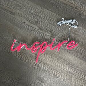 “inspire” neon sign